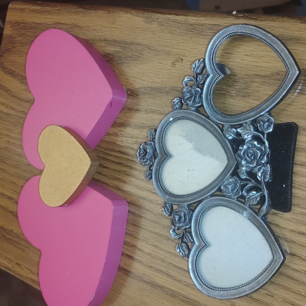 3 hearts made of wood and a 3 heart picture frame